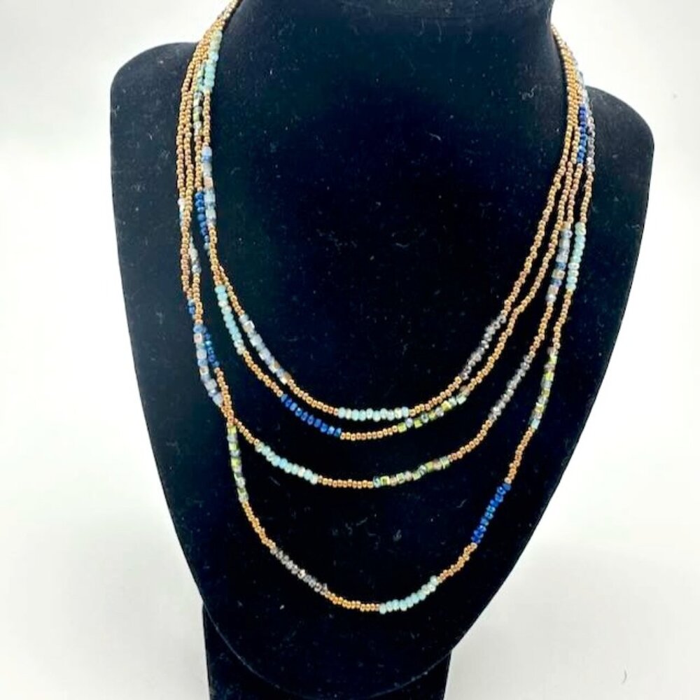 Double strand long beaded necklace - blues and golds